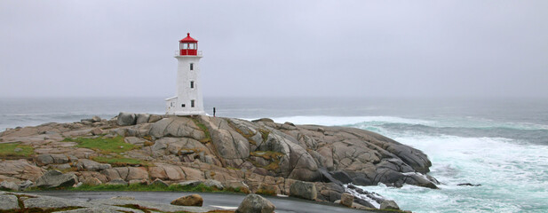 The iconic Peggy's Cove Lighthouse located in Nova Scotia has withstood many storms and crashing...