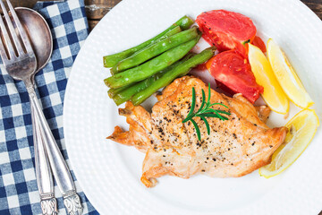 chicken dish with vegetables french fries