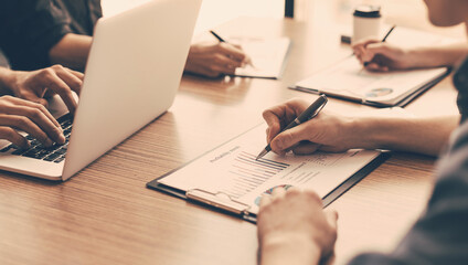 group of the employees analyzing financial charts