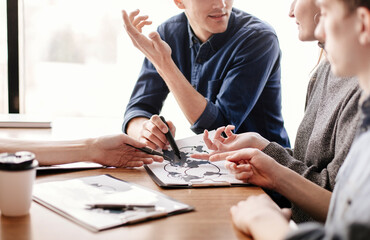 close up. group of employees developing new logistics schemes.