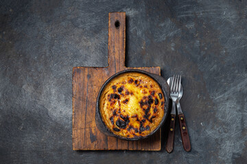 Latin American Corn pie. Chilean Pastel de Choclo in clay bowl