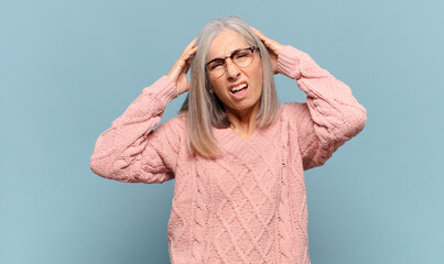 middle age woman feeling frustrated and annoyed, sick and tired of failure, fed-up with dull,...
