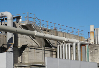 Industrial plant with exposed pipes  and reinforced concrete