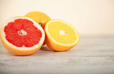 orange and grapefruit on a white table background
