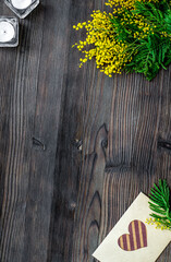 concept International Women Day with flowers wooden background top view