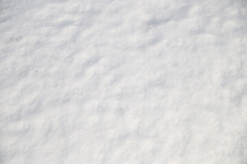 Fototapeta na wymiar Compressed snow on ground on sunny winter day