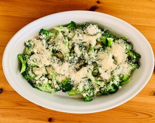 Step-by-step preparation of broccoli with cheese on a wooden table preparation of the necessary ingredients, top view