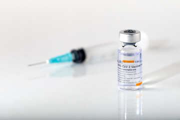 Izmir, Turkey -  01-26-2021: Sinovac Covid -19 vaccine vial and injection syringe isolated on white...