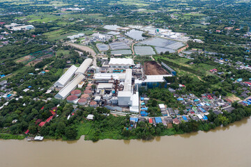 Industrial factory with warehouse, tanks and machine in green land
