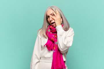 middle age woman feeling bored, frustrated and sleepy after a tiresome, dull and tedious task,...