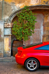 Fragment of a red sports car - 408598003
