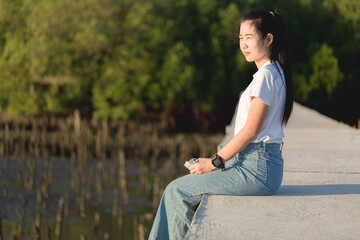 Asian woman sitting in the park
