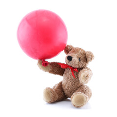 Small brown Teddy Bear playing with red balloon