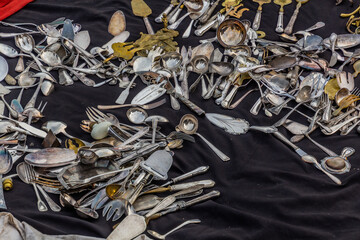 BRUSSELS, BELGIUM - DECEMBER 18, 2018: Cutlery for sale at Marolles Flea Market at the Jeu de Balle square in Brussels, capital of Belgium