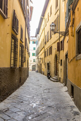 Fototapeta na wymiar Narrow alley in the centre of Florence, Italy