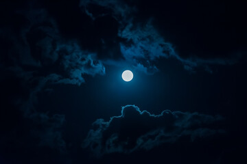 full moon in the night sky among the clouds. © wasdok101
