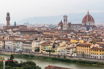 Fototapeta na wymiar Aerial view of Florence, Italy. Cathedral (Duomo) and the Palazzo Vecchio, town hall.