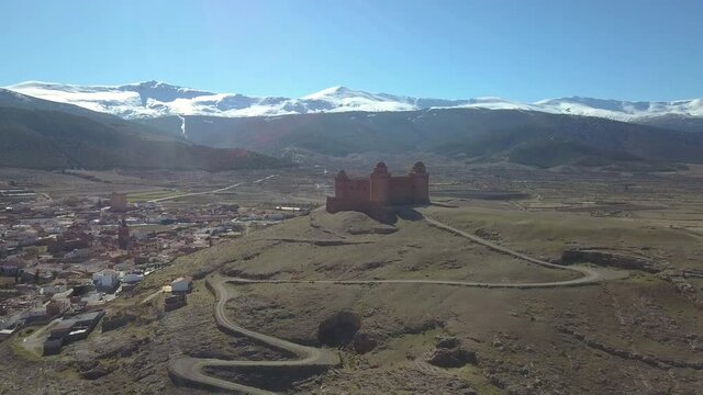 Drone shot of the renaissance fortress of La Calahorra in Granada, Spain.