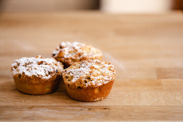 Three mince pies on a kitchen counter