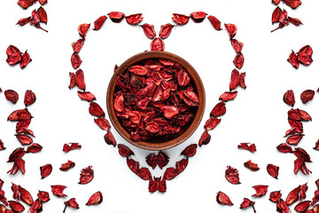 Heart shape made of rose petals isolate on white