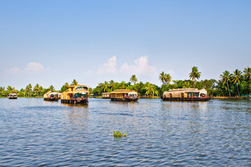 Houseboats on the backwaters of Kerala in Alappuzha (Alleppey) in India. A traditional tourist attraction is the house-boat on the river channels of Kerala.
