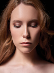 Obraz premium Close-up portrait of beautiful young girl with closed eyes