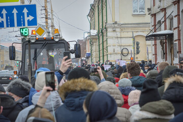 A crowd of people on the street of the city .