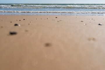 beach sand and waves with copy space and selective focus