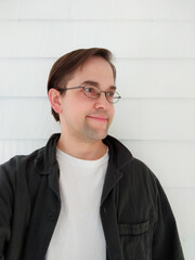 Smiling Man with Glasses Against a White Background, Blank Tee-shirt