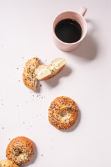 cup of coffee and bagel with cream cheese