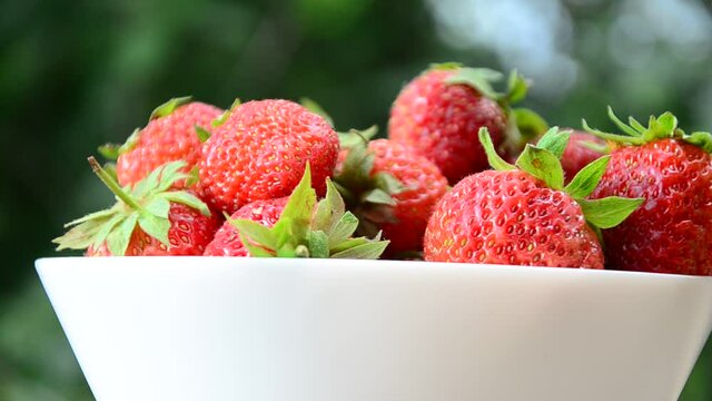 resh strawberries in bowl natural background