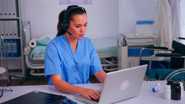 Assistant offering medical online services using headphone answering calls, making appointments. hospital call center Healthcare physician in medicine clinic, receptionist doctor nurse helping with