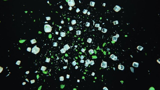 Splashing frosted ice cubes with mint leaves in 4K Slow motion