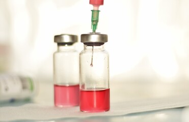 vaccine in sterile vials and syringes