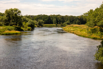 View of healthy nature on the river Mulde taken from the Mulderadweg cycle path near the city of...
