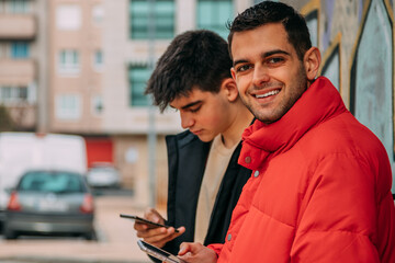 young people having fun in the street with phone