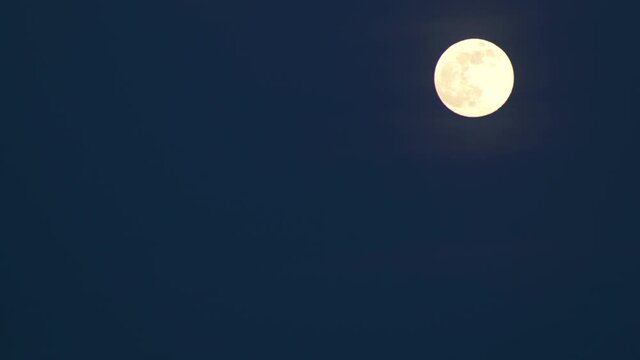 Full Moon Rising In The Corner of The Dark Sky
