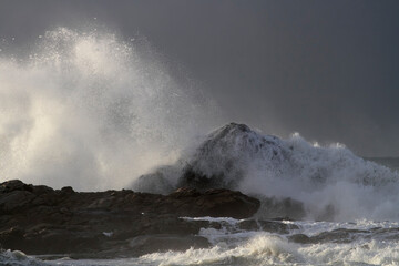 Wave breaking over cliff