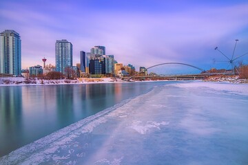 Long Exposure Sunrise Over An Icy Bow River