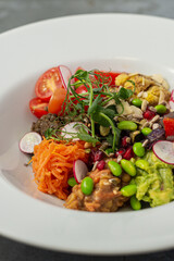 Mixed bean poke bowl salad with raddish, tomato, snap peas, green beans