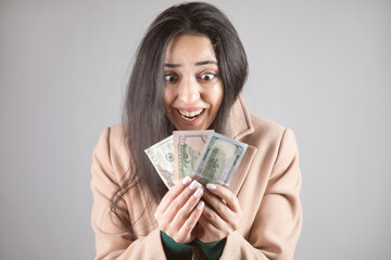 surprised woman holding money