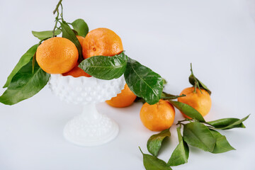 Fresh harvest of mandarin, tangerine with leaves.