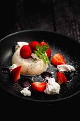 Vanilla Panna Cotta served with fresh Rutland strawberries, meringue shards and raspberry coulis