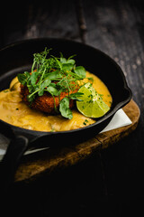 Smoked Haddock and Chive Fishcakes served with mixed baby leaf salad and creamed cheesy leek sauce