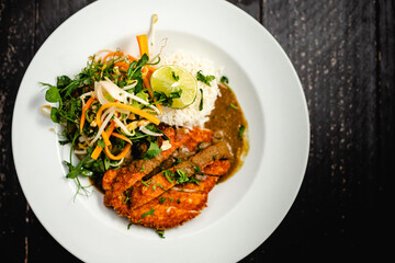 Chicken Katsu Curry with fragrant basmati rice, beansprouts, pea shoot, peanut and pickled vegetable salad