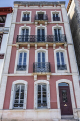 Fototapeta premium Traditional red and white Basque houses - typical architecture of Saint Jean de Luz, Pyrenees-Atlantiques department in southwestern France.