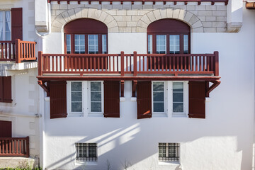 Traditional red and white Basque houses - typical architecture of Saint Jean de Luz, Pyrenees-Atlantiques department in southwestern France.