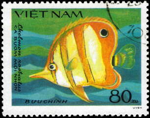 Postage stamp issued in the Vietnam with the image of the Copperband Butterflyfish, Chelmon...