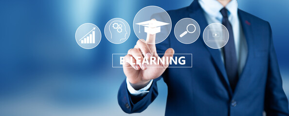 businessman pressing e-learning button