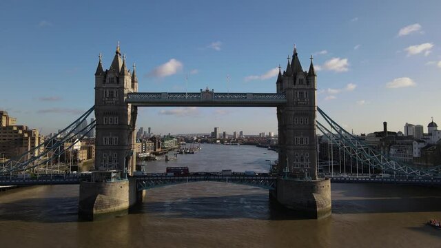 Establishing Aerial drone View of Tower Bridge, crossing inside the bridge, Thames River, United Kingdom, UK 2021